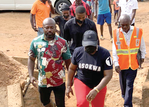 Patricia Appiagyei (right) with her entourage during the tour of the flood-hit areas in Asokwa