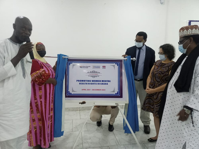 Hajia Lamnatu Adam (2nd left) , Executive Director , Songtaba unveiling a plaque to launched the project. With her in the picture are Alhaji Shaibu Alhassan Shani, the Northern Regional Minister (left). On the right is  Mr Lawrence Akubori ( in suit),Ms Lyle Kamara (middle) all of the Ghana Somubi Dwumadie  and Dr. Al-Hussien  Zakaria (third right), a member of the Northern Regional Peace Council.