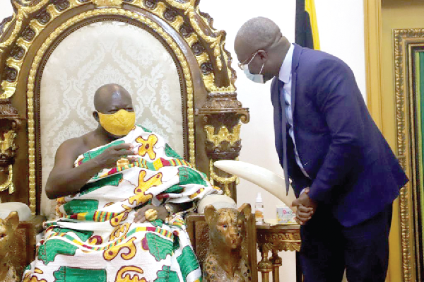 • Otumfuo Osei Tutu II (seated), interacting with Mr Ben Hassan Ouattara, MD of Vivo Energy Ghana, at the Manhyia Palace in Kumasi