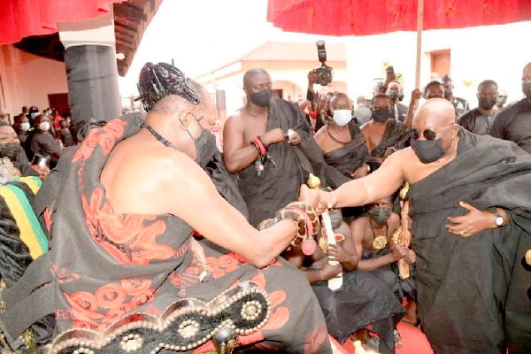Daasebre Oti Boateng (left), the Omanhene of New Juaben, exchanging greetings with President Akufo-Addo at the funeral of Barim Okyere Boateng, the Ayokohene of the New Juaben Traditional Area