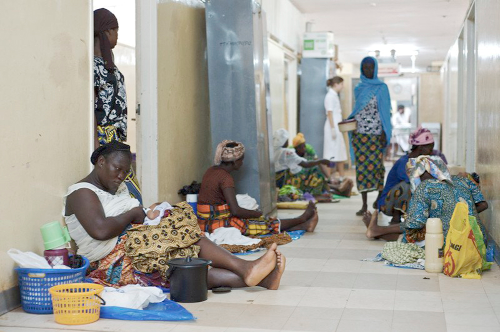 Some mothers with their newly delivered babies on the floor of wards