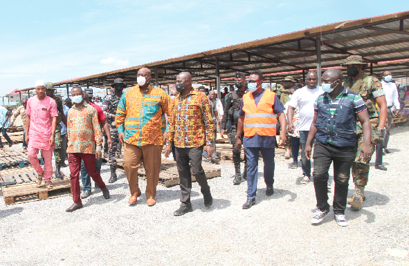 • Mr Henry Quartey (3rd left), Greater Accra Regional Minister, with Mr Dan Botwe (3rd right), Minister of Local Government and Rural Development, and Mr Clement Wilkinson (2nd right), Municipal Chief Executive for Ga West Municipal Assembly, touring the market at Adjen Kotoku . 