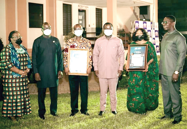 Rev. John Ntim Fordjour (2nd right), Deputy Minister of Education, flanked by the two awardees, Mrs Lydia Lariba Bawa (right) and Mr Kwame-Gazo Agbenyadzie (3rd right). With them are other officials of the CIIG