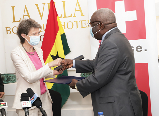Dr Kwaku Afriyie (right), Minister of Science, Technology and Innovation, and Federal Councillor Simonetta Sommaruga, former President of the Swiss Confederation and current Swiss Minister for Environment, Traffic, Energy and Communications, exchanging documents after the signing ceremony on the implementation roadmap. Picture: EDNA SALVO-KOTEY