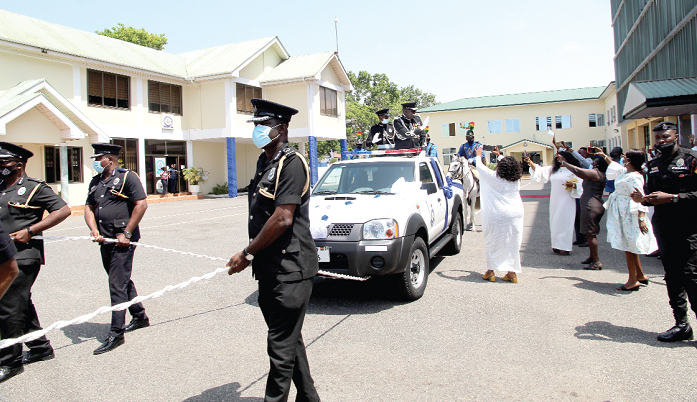 COP Mr Samuel Monney, Director-General, Technical of the Ghana Police Service, waving at some admirers at the Police Headquarters during the pull-out parade. Picture: ESTHER ADJEI