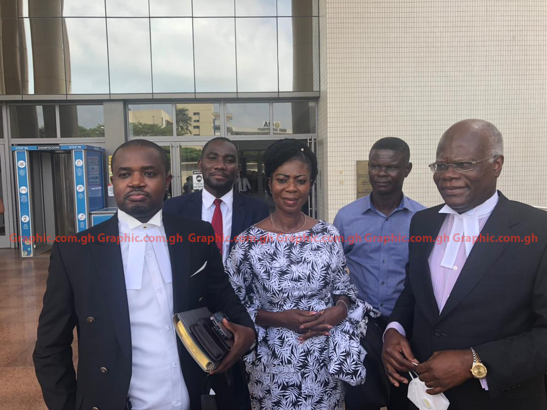 Mrs Kate Quartey - Papafio (middle) with her lawyers - Mr K.T. Hammond (right) and Mr Godwin Tameklo (left), after she was discharged 