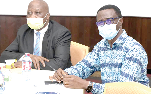 Mr Justice Samuel K. Marful-Sau (left), Director of the Judicial Training Institute, with Rev. Ammishaddai Owusu-Amoah, Commissioner–General of the Ghana Revenue Authority, at the training workshop on tax laws