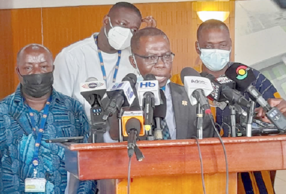  Dr Isaac Opoku (middle) addressing the press. With him is the Majority Chief Whip, Mr Frank Annoh-Dompreh (2nd left)