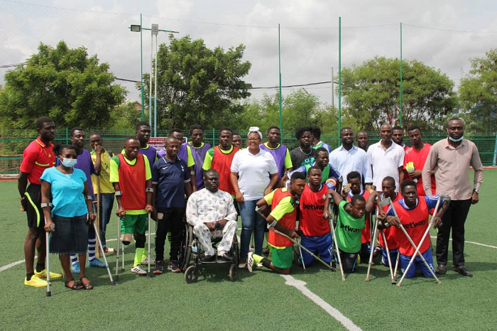Some of the PWDs in a photo with dignitaries at the fun games