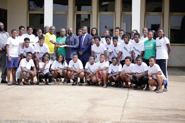 • Tamimu Issah (arrowed), a representative of the Vice-President, donating the cash to Coach Yussif Basigi in the presence of the team