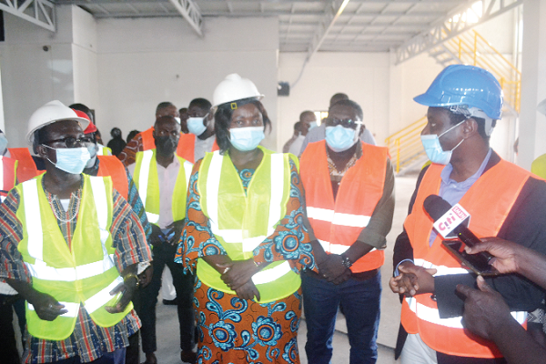 • Dr Jojo Benin (right), an official of Rikpat Limited, explaining the company's operations to Mrs Assan (second left), Central Regional Minister, and Mr Darko Quarm, DCE, Gomoa East, during a visit to the factory