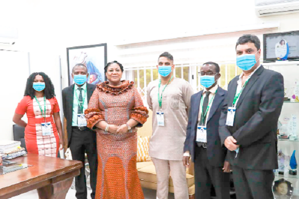 • Mrs Rebecca Akufo-Addo (3rd left), First Lady, with Nana Yaw Mohan (3rd right), Public Relations Director of UNICHEM Group Ghana, and other pharmacists of the company after the presentation