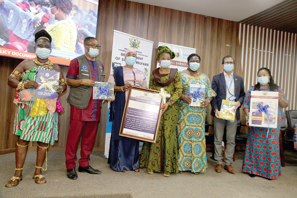 •  Hajia Lariba Abudu (3rd left), Deputy Minister of Gender, Children and Social Protection, and Dr Afisah Zakariah (4th right), the Chief Director of the Ministry holding the citation. With them are Rev. Dr Comfort Asare (right), Director of the Department of Social Welfare; Mr Muhammad Rafiq Khan (2nd right), Chief of Child Protection, UNICEF Ghana and Mr Peter Takyi Peprah (2nd left), Assistant Chief Statistician of the Ghana Statistical Service. 