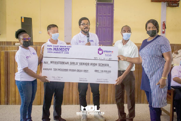 • From right: Mrs Lily Ayim, the Assistant Headmistress of Mfantsiman SHS; Mr Mark Benison, a science teacher at the school; Mr John Ayayee, an investment strategist; Mr Kim Chol Un, Procurement Engineer with Steady X Haier Global Business; Miss Patience Affere, Landscape designer, Mamdev Gh. Ltd, after the presentation