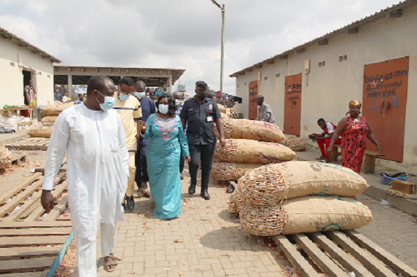  • Ms Cecilia Abena Dapaah (2nd right), the Minister of Sanitation and Water Resources, touring Adjen Kotoku where the onion sellers have been relocated.