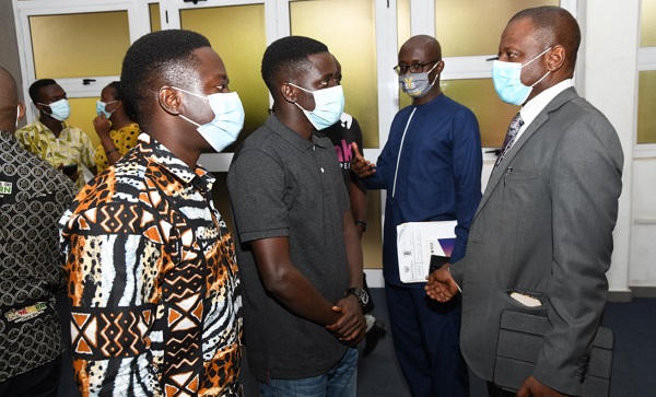 Dr Patrick Kuma-Aboagye (left), Director-General of the Ghana Health Service, explaining a point to some journalists on the latest update on COVID-19. Picture: EBOW HANSON