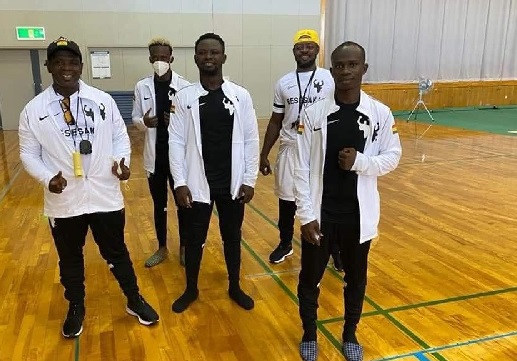The Black Bombers with their trainers in Japan