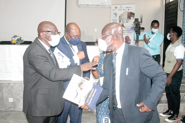 Prof. Felix Asante (left), Pro-Vice-Chancellor, Research, Innovation and Development (RID), University of Ghana (UG), interacting with Prof. Eric Danquah (right), Director, West Africa Centre for Crop Improvement (WACCI), after the conference. With them is  Prof. Gordon Awandare (middle), Director, WACCBIP. Picture: Maxwell Ocloo 