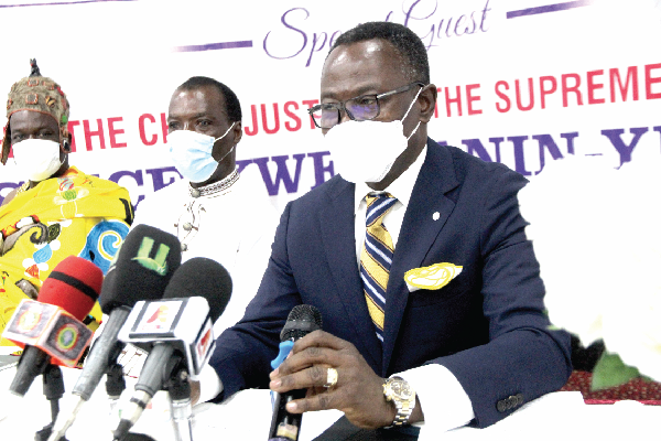 • Justice Yonny Kulendi (right), Justice of the Supreme Court, inaugurating  the society. With him are Mr Calvis Okine (middle), Chairman of the Professional Auctioneers Society Ghana and Nana Kwesi Addo II (left), Akyem Kotoku Mponua Gyasehene, Pankese. 