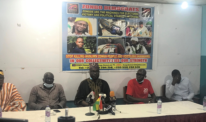 Sheikh Mubarak Zakaria Hussein (in black) addressing the press conference flanked by some executives of Zongo Democrats .
