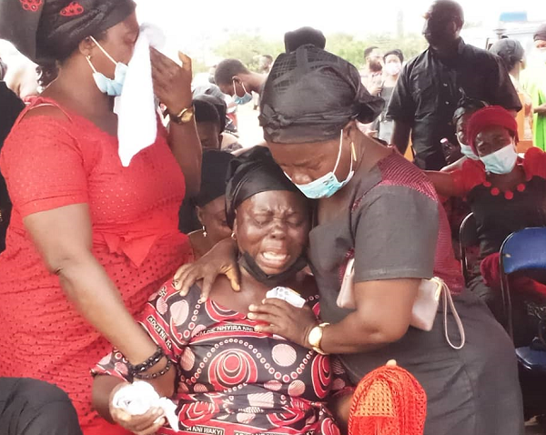  The mother of the slain policeman being consoled