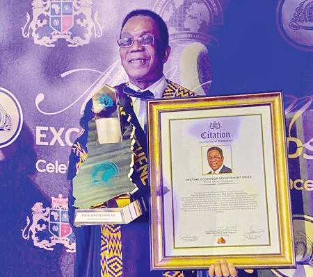 Prof Kwesi Yankah, former Minister of State in charge of Tertiary Education, displaying his award and the citation