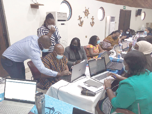 • Some of the Attorneys and Heads of Division /Units at the A-G Department engaged in a hands-on practice of the system at the training workshop. 