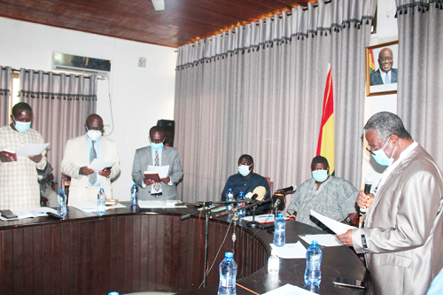 Justice Patrick Baaye, the Sunyani High Court judge, swearing- in the members of the Bono Regional Lands Commission