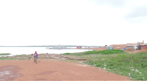 The banks of the Oti River littered with plastic waste