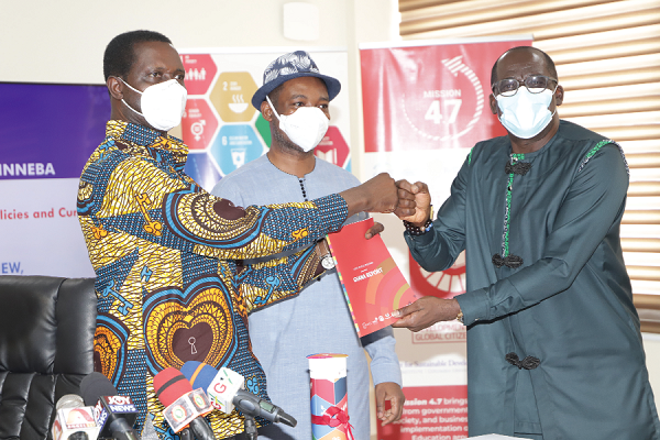 Prof. Andy Ofori- Birikorang (right), Pro Vice- Chancellor, University of Education, Winneba (UEW), presenting the Global School Programmme-Ghana Report to Dr. Yaw Osei Adutwum (left), Minister of Education, during the meeting. With them is Chief Nat Ebo Nsarko (2nd right), Executive Director, Millennium Promise Alliance (MPA).