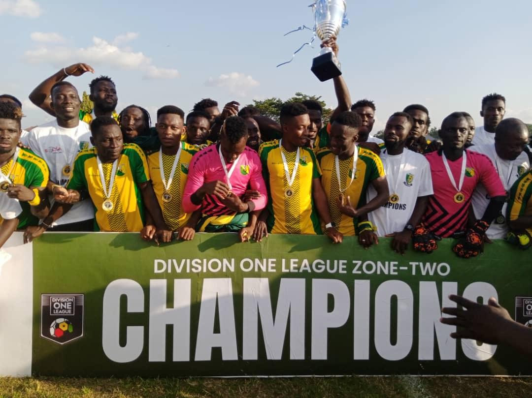 Club officials, technical men and players of Bibiani Goldstars display their trophy and medals