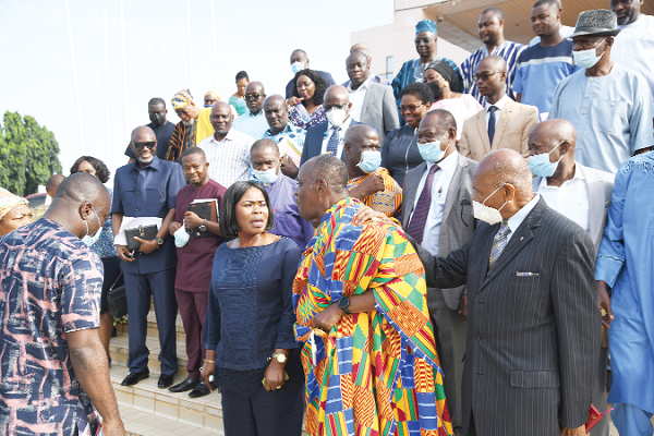 Nana Otuo Sirirboe II (in Kente cloth), Chairman of the Council of State, interacting with some representatives of business groups after the meeting. Picture: EBOW HANSON