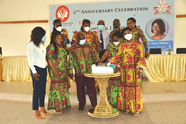Prof. Mary Boadu (right), President of the Ghana Atomic Energy Commission Ladies Association, cutting the anniversary cake with Prof. Mary Obodai (2nd right),  former Director of CSIR-FRI and Prof. Benjamin J. Botwe Nyarko (3rd right) , Director-General of the Ghana Atomic Energy Commission. With them are executives of the association. Picture: ALBERTA MORTTY