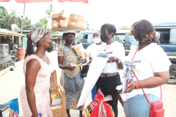 • Mrs Delese Mimi Darko (2nd right), CEO of FDA, and Mrs Olivia Boateng (right), the Head of Tobacco and Substance Abuse of FDA, educating some traders at Nsawam on the effects of tobacco use