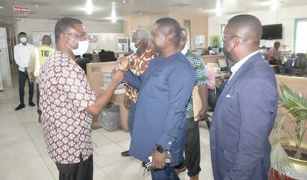 Mr Kobby Asmah (left), Editor of the Daily Graphic, in a fist bump with Mr Gayheart Edem Mensah, aspiring GJA President. Picture: ESTHER ADJEI