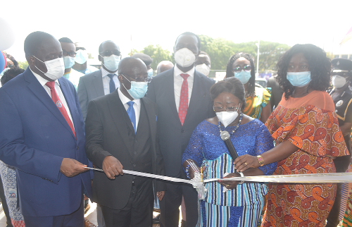 Mrs Osei-Opare (2nd right), cutting the tape to commission the project. Looking on are Mrs Justina Marigold Assan, Central Regional Minister(right) and Prof Afful-Broni(left),Vice Chancelor, 