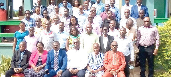  Mr Christian Nti (seated 3rd left), Deputy Chief Executive Officer of the GHA in charge of Maintenance; Mr Charles Adebofour (seated 3rd right), Eastern Regional Director of GHA, with other directors and quantity surveyors in Koforidua