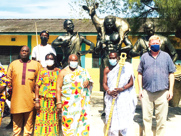 Neenyi Ghartey VI (middle), Omanhen of the Effutu Traditional Area; Mrs Comfort Oti-Akenteng, (2nd right), the Headmistress of the school, and other dignitaries after unveiling the statue