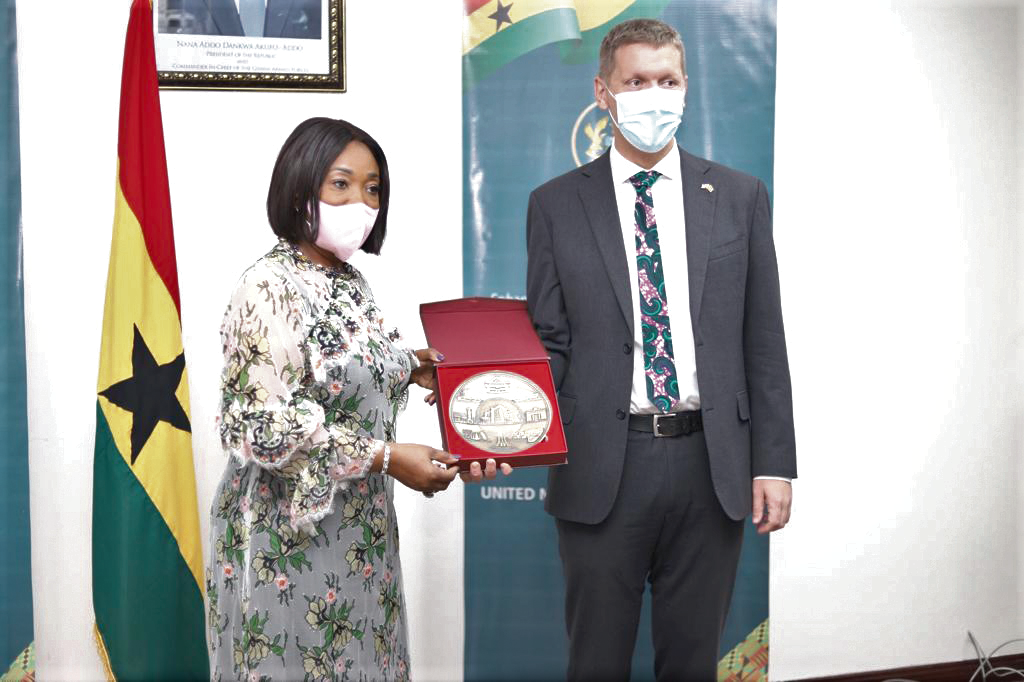  Ms Shirley Ayorkor Botchwey presenting a parting gift to Mr Iain Walker, the outgoing British High Commissioner to Ghana