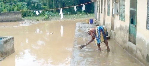 A tenant cleaning up after the flood