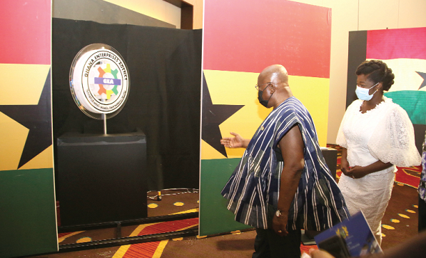 President Akufo-Addo and Mrs Kosi Yankey-Ayeh (right), the CEO of the Ghana Enterprises Agency, admiring the logo after the unveiling ceremony in Accra. Picture: SAMUEL TEI ADANO