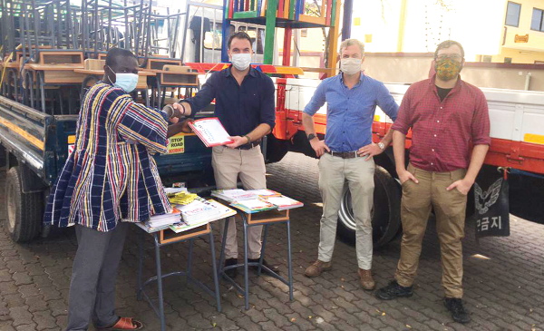  Mr Jeremy List (2nd left) making the presentation to Nana Osei Nkwantabisa whiles Cameron (2nd right) and Joshua looks on
