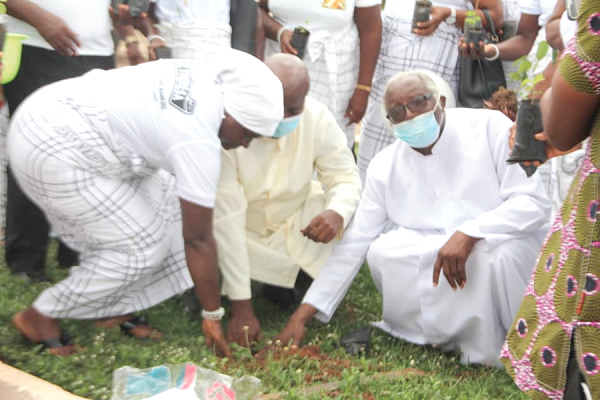   Dr Augusta Adjei Frimpong (left) being assisted by Rev Fr Felix James Otoo (2nd left), to plant a tree at the premises of St Anthony Catholic Church, Agona Swedru