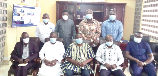 • Mr Kwasi Adu-Gyan (seated middle), Bono East Regional Minister, with some members of the committees