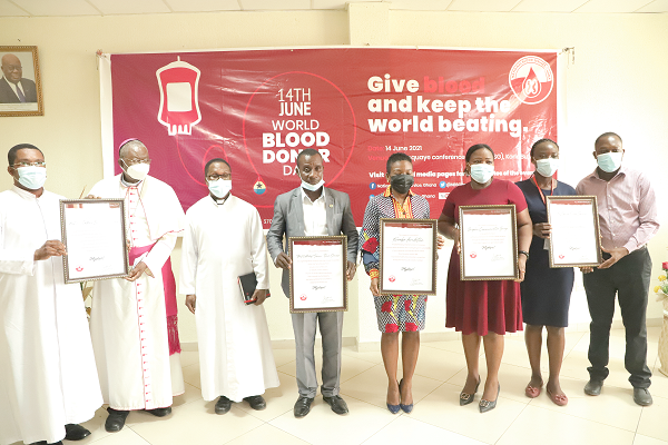 Blood Donors Day 2021 awardees displaying their certificates of recognition. Picture: EDNA SALVO-KOTEY