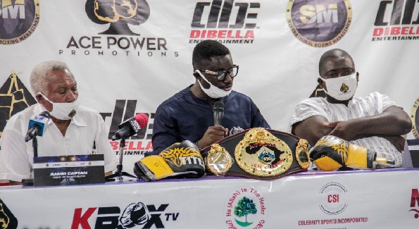 Mr Isaac Amankwah (middle), the General Manager of Ace Power Promotions, delivering his address at the press conference