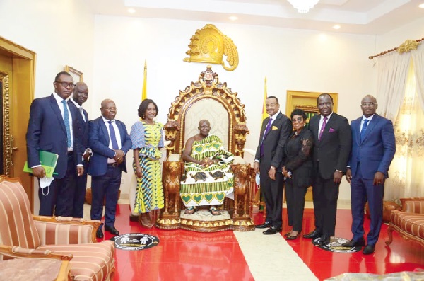 Mr Alex Bernasko (4th right), Board Chairman of ADB; Mrs Abena Osei-Asare (4th left), Deputy Minister of Finance designate; Dr John Kofi Mensah (3rd left), MD of ADB, and other board and management members of ADB with the Asantehene, Otumfuo Osei Tutu II