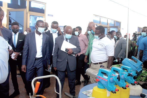 • Mr Kwaku Agyeman-Manu (2nd right), Minister of Health, and Mr Joseph Siaw Agyepong (left), Executive Chairman, Jospong Group, inspecting some machines during an exhibition after the inauguration. 