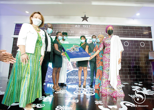 Mrs Samira Bawumia (right), Wife of the Vice-President; Madam Anne Claire Dufay, UNICEF Country Representative, and other dignitaries showcasing the policy document after the launch