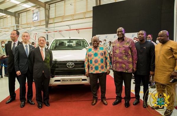 President Akufo-Addo (4th right), Mr Alan Kyerematen (3rd right), the Minister of Trade and Industry, Mr Tsutomu Himeno (3rd left), Japanese Ambassador, and a delegation from Toyota standing by one of the vehicles.